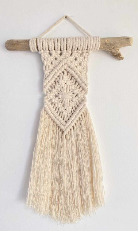 Macrame wall hanging on driftwood