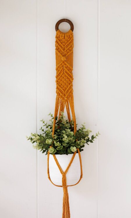 Mustard yellow macrame plant hanger, handmade in Hawaii.